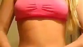 Blonde teen with a sexy smile does a nice strip tease