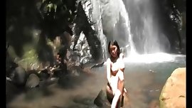 beautiful naked asian by the waterfall