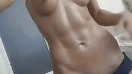 Fit girl flexes her abs