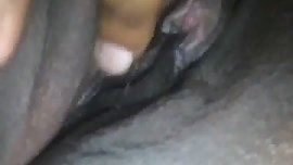 Tinkey rubs her ebony pussy