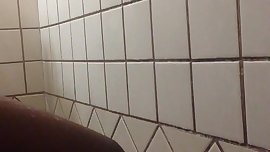 Wet darkskin fucks dildo in shower