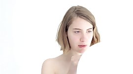 Young looner babe blowing and popping her first balloon