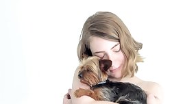 Hot naked blonde cuddling her puppy