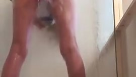 Fucking in the shower with a huge dildo